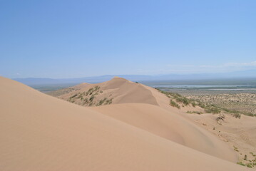 Fototapeta na wymiar Singing dune in Kazakhstan. The musical sand of the Altyn-Emel National Park. Desert. Dune.