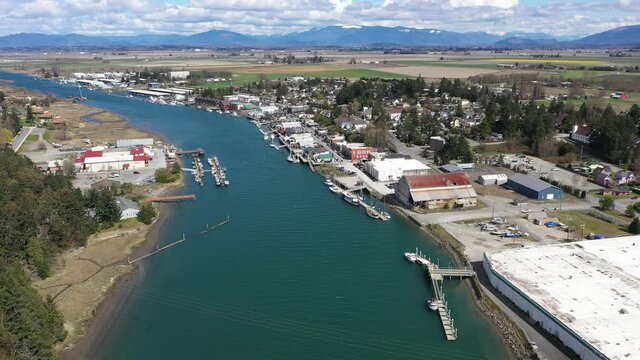 Cinematic 4K aerial drone dolly shot of Swinomish Village, Swinomish Channel and La Conner on a native American indian tribal reservation in Washington state