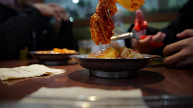 Seoul Korea Kimchi cutting table preparation on the dinner table
