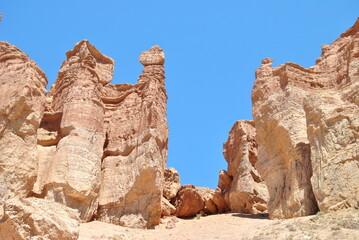 Fototapeta premium Charyn Canyon in Kazakhstan. Valley of castles in Kazakhstan. An analogue of the American Grand Canyon. Aeolian landforms. Colorful stone mountains in the desert. Desert. Plain.