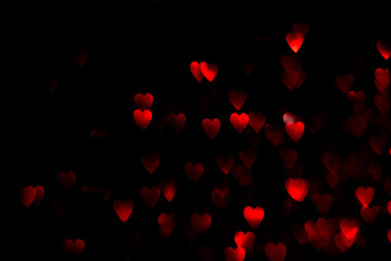 Red hearts, blurred bokeh lights on black background. Glitter sparkle for valentines day. Overlay for your design
