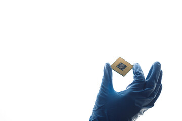 Hand in blue glove holding computer microchip