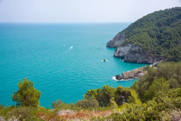 Fotobehang Beautiful rocky sea coast in Italy with clear water © Maresol