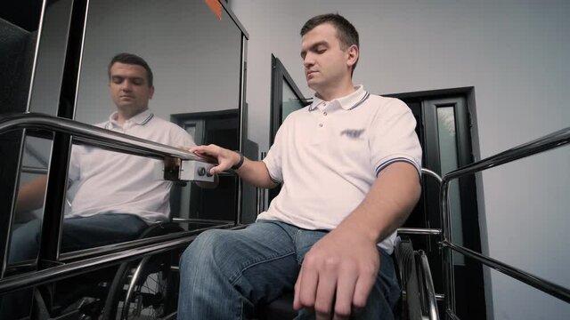 Special elevator for the person with a physical disabilities. A man in a wheelchair uses a special elevator