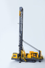 Large drill rig for drilling boreholes for explosives on a white background. Technologies of...