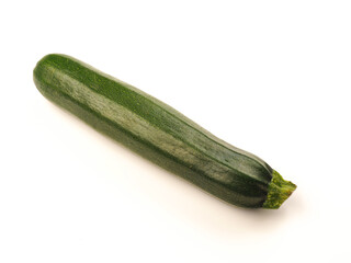 One organic zucchini on a white studio background