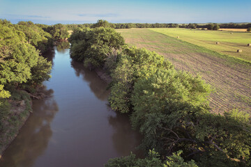 River and hay field