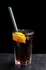 Alcoholic drinks at the bar. Bartender's hands in the process of making drinks.