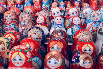 Fototapeta na wymiar Colorful Russian nesting dolls matreshka at the market. Matrioshka Nesting dolls are the most popular souvenirs from Russia