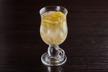 Alcoholic drinks at the bar. Bartender's hands in the process of making drinks.