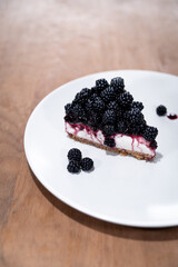 blackberry tart slice dessert wood white 