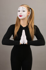 Clown in the form of pantomime, petition hand gestures.