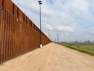 USA-Mexico border in Texas, United States. The newly built border wall.

Walls and security roads.