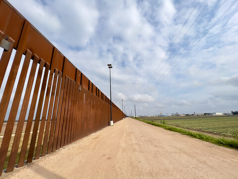 USA-Mexico border in Texas, United States. The newly built border wall.
Walls and security roads.