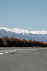 Road in greek mountains at Edessa territory with snow in the mountains and dead nature from the cold 