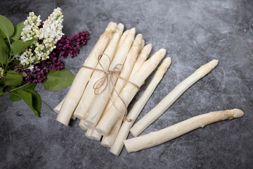 Bunch of fresh white asparagus on a stone table