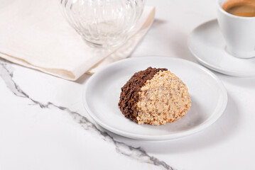 Shortcake on a plate on a white marble background