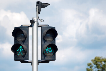 Green bicycle and pedestrian traffic lights. Green traffic light for bikes, gives cyclists...