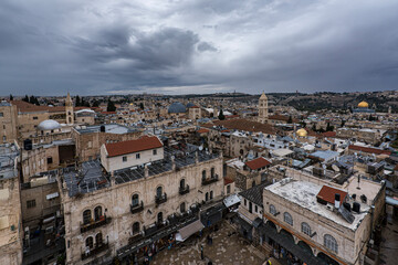 Obraz premium Top view of Jerusalem roofs under stormy sky