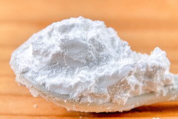 Macro of icing sugar in a wood background