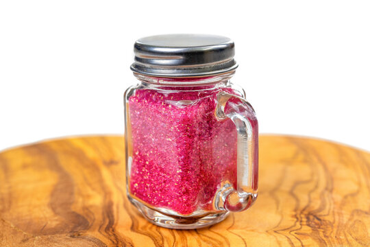 Red Confectionary Sugar In A Small Mason Jar