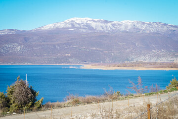 View of Vegoritida lake in Pella Greece on a sunny day in the background the mount Voras with a bit of snow 