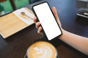Close up of women's hands holding cell telephone with blank copy space scree for your advertising...