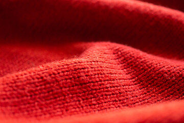 closeup red knitted woolen fabric texture background