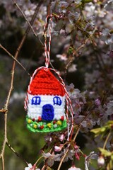 Handmade crocheted Martisor, with red and white string. It is a Romanian traditional symbol of the beginning of spring.