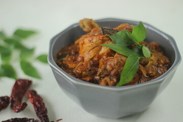 Chicken gravy. Semi dry Chicken gravy prepared in Kerala style with onions tomatoes and spices