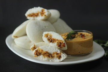 Chicken Stuffed steamed rice cake. Steamed rice cake stuffed with Chicken masala. Commonly called chicken stuffed Idli in Kerala. Served with coconut chutney