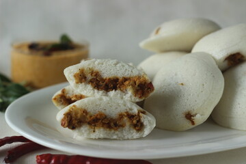 Chicken Stuffed steamed rice cake. Steamed rice cake stuffed with Chicken masala. Commonly called chicken stuffed Idli in Kerala