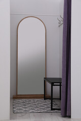 Empty dressing room in fashion store. Stylish interior