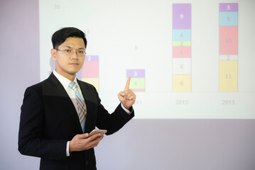 Asian businessman presents business results to company president