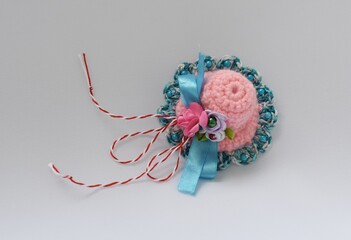 Handmade crocheted Martisor, with red and white string. It is a Romanian traditional symbol of the beginning of spring.