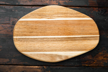 Empty cutting board, on old dark wooden table background, top view flat lay , with copy space for text or your product