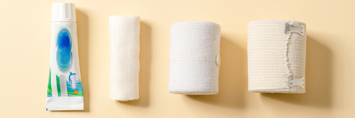Overhead view of the ointment and the bandage lying in a studio