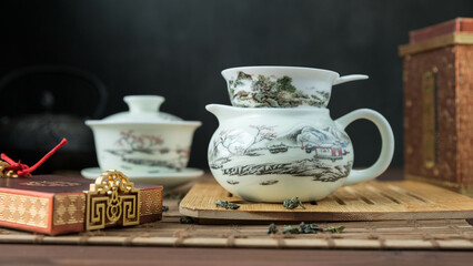 Gaivan and chahay with green tea  
 and tea brew on a brown background. Tea ceremony.  Traditional chinese tea utensils. 