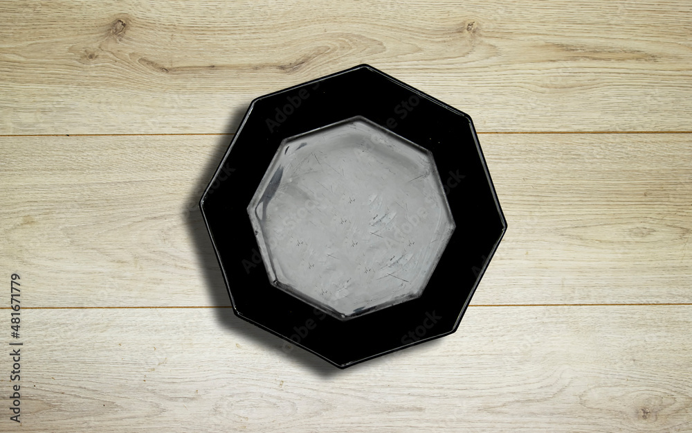 Sticker empty ceramic black octagon polygon shape plate on wooden planks table