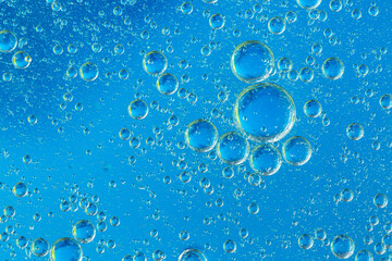 Blue macro bubbles,Colorful artistic of oil drop floating on the water.