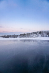 Winter landscape, panorama, banner - view of the frozen river in Lapland