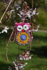 Handmade crocheted Martisor, with red and white string. It is a Romanian traditional symbol of the beginning of spring.