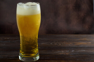 beer in a glass on a dark background