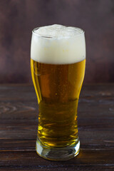 beer in a glass on a dark background