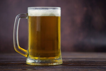 beer in a glass on a dark background