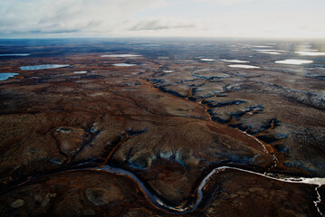 Summer nature landscape from above. Mountain range aerial view. river bank in the morning in the tundra. Taimyr Peninsula, Russia. Norilsk