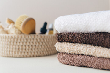 Fototapeta na wymiar pack of terry cotton towels in the bathroom - self-care and spa treatments