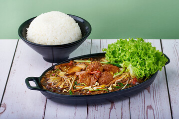 Asian food Rice Teriyaki Lion Mane Shroom with veg in bowls on wood table
