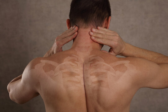 Man suffering from neck pain. Chiropractic concept. Sport exercising injury