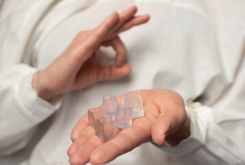 A woman's hand holds a heel guard of a dance shoe.
The benefit of using heel protectors is to...